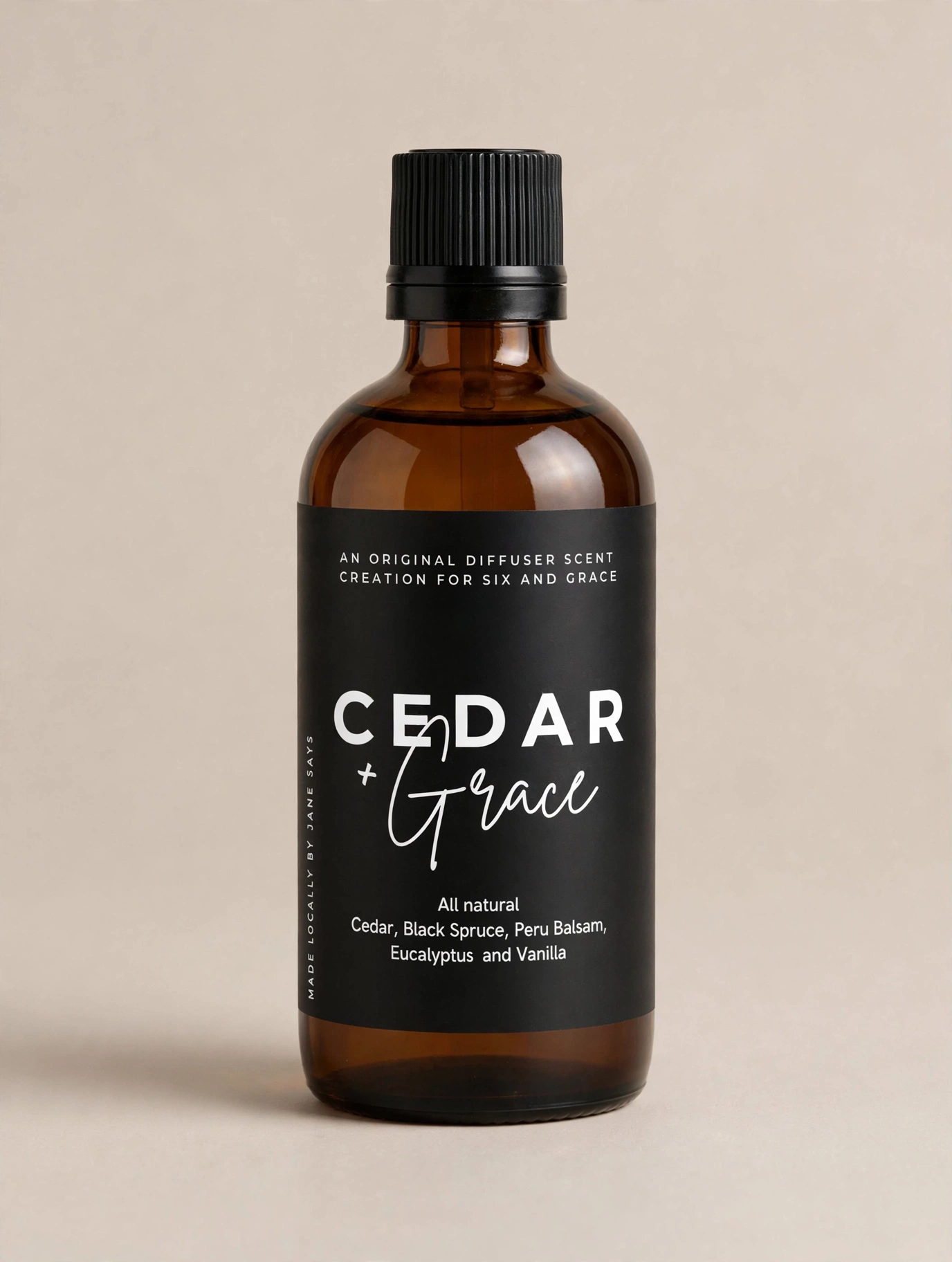Cedar and Grace diffuser scent bottle with reeds