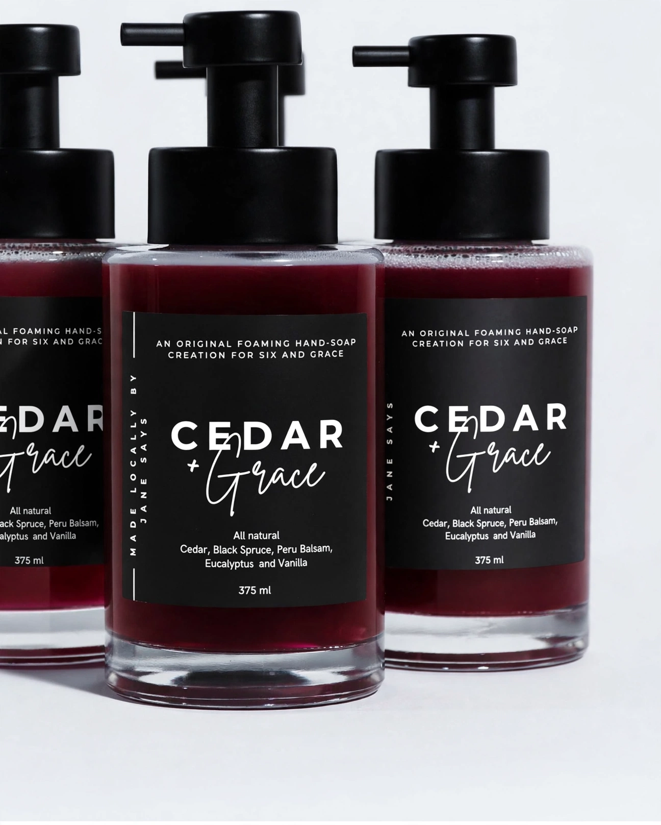 Burgundy Cedar and Grace foaming hand soap in a pump bottle